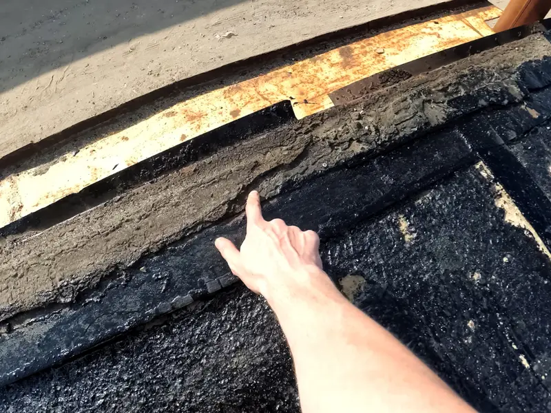 inspecting roof damage on a commercial building